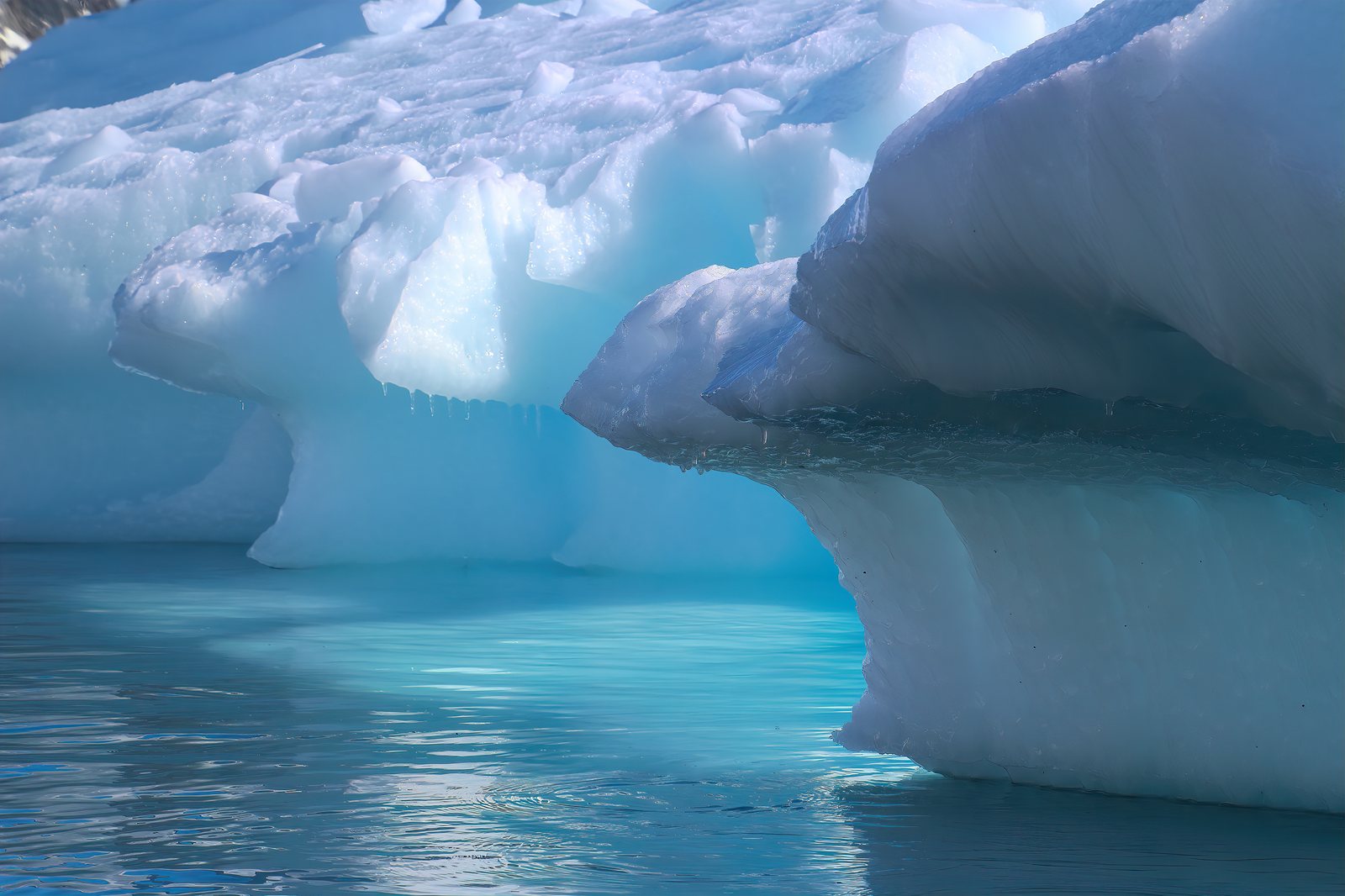 Iceberg detail over teal water, Antarctic Peninsula