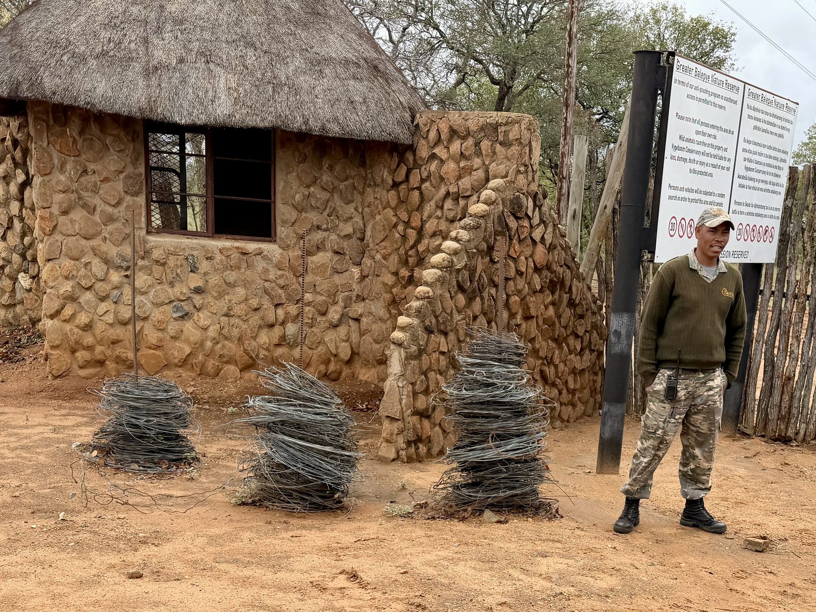 Coils of recovered wire snares outside the main gate, Greater Balepye Nature Reserve