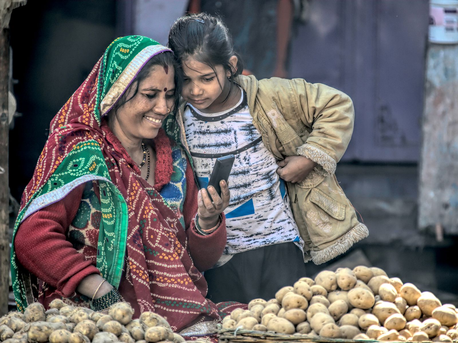 Grandmother and granddaughter, market day, Rajasthan, India