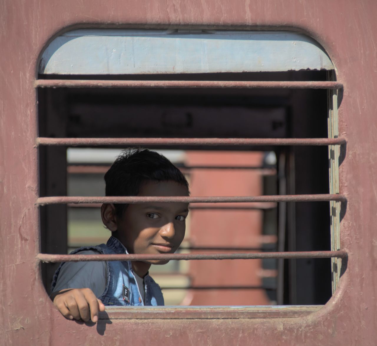 Boy at the train window, Rajasthan, India