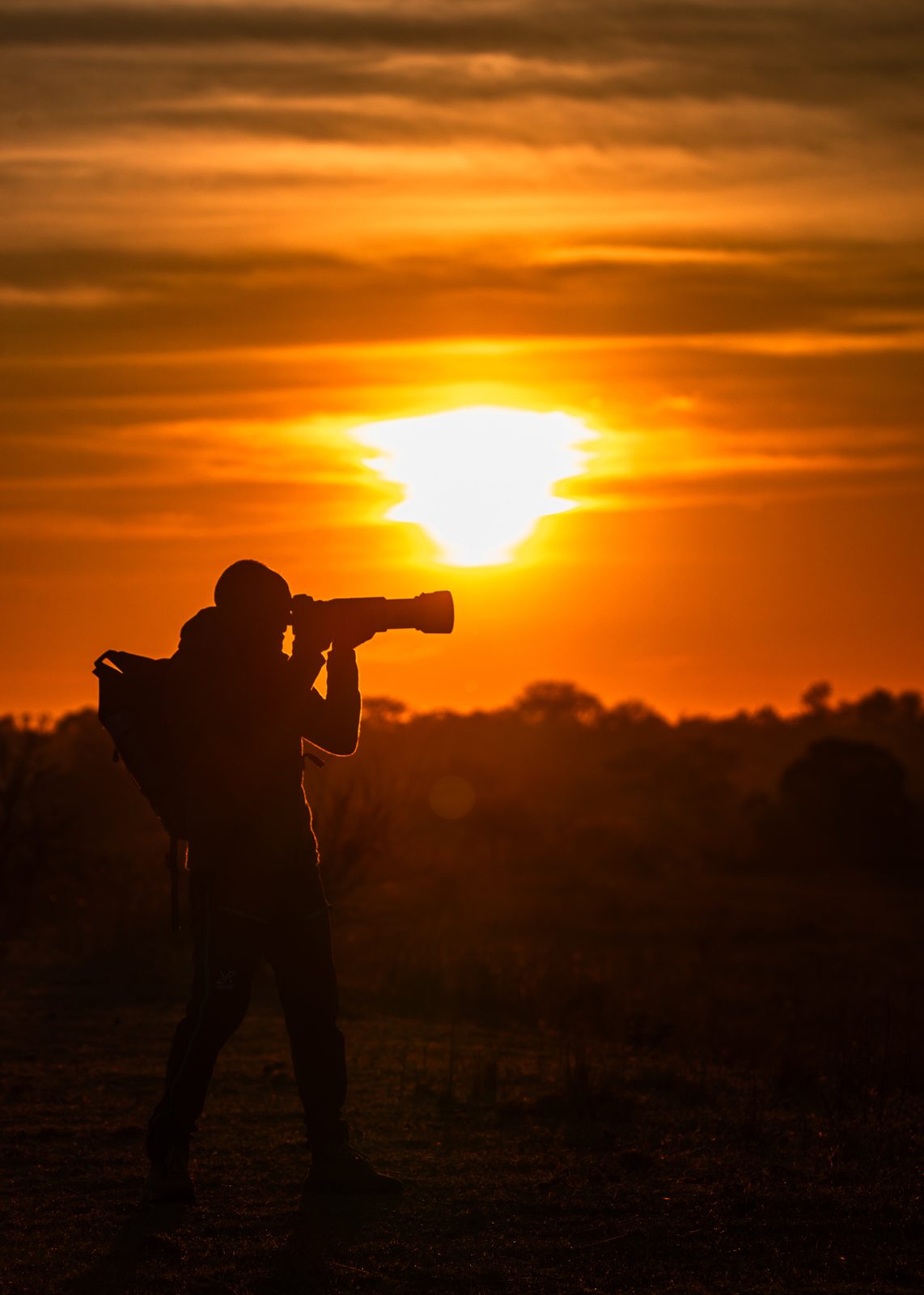 James Kenning, silhouetted at sundown, Zimbabwe